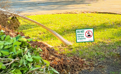 pet waste sign in a swale